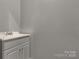 A minimalist bathroom offers a light gray vanity and sink with ample counter space at 282 W Shiloh Unity Rd, Lancaster, SC 29720