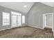 Bedroom with vaulted ceilings, a ceiling fan, and a large window with french doors at 282 W Shiloh Unity Rd, Lancaster, SC 29720