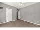 Bedroom offers modern neutral walls, plush carpet, and two access doors at 282 W Shiloh Unity Rd, Lancaster, SC 29720