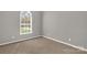 Bedroom with a single window and neutral colored carpet at 282 W Shiloh Unity Rd, Lancaster, SC 29720