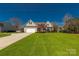 Charming two-story home with a well-manicured lawn and inviting curb appeal on a sunny day at 282 W Shiloh Unity Rd, Lancaster, SC 29720
