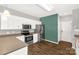 Bright kitchen boasts stainless steel appliances and wood-look flooring at 282 W Shiloh Unity Rd, Lancaster, SC 29720