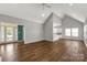Spacious open-concept living area with hardwood floors, white trim, and a view into the kitchen at 282 W Shiloh Unity Rd, Lancaster, SC 29720