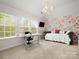 Charming bedroom featuring a daybed and ample natural light at 3100 Stanway Ct, Waxhaw, NC 28173