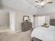 Vaulted bedroom features a gray dresser, white doors, and neutral carpet at 3100 Stanway Ct, Waxhaw, NC 28173
