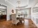 Elegant dining room with hardwood floors and a stylish chandelier at 3100 Stanway Ct, Waxhaw, NC 28173
