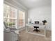 Bright home office with custom paneling, large windows, and neutral tones at 3100 Stanway Ct, Waxhaw, NC 28173