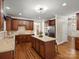 Spacious kitchen featuring granite countertops, custom cabinetry, stainless steel appliances, and island at 3100 Stanway Ct, Waxhaw, NC 28173
