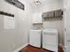 Well-organized laundry room with modern washer, dryer, and storage solutions at 3100 Stanway Ct, Waxhaw, NC 28173