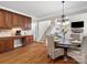 Kitchen and breakfast nook lead to Gathering room with fireplace and staircase at 3100 Stanway Ct, Waxhaw, NC 28173