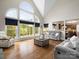 Bright living room with large windows, hardwood floors, and comfortable seating area at 3100 Stanway Ct, Waxhaw, NC 28173