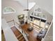 Aerial view of a spacious living room showcasing fireplace and large windows at 3100 Stanway Ct, Waxhaw, NC 28173