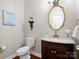 Stylish powder room featuring a marble vanity top and modern fixtures at 3100 Stanway Ct, Waxhaw, NC 28173