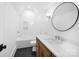 Bathroom featuring dark floors, a wooden vanity, and a tub at 3212 Willow Oak Rd, Charlotte, NC 28209