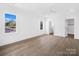 A minimalist bedroom featuring wood floors, and neutral walls at 3212 Willow Oak Rd, Charlotte, NC 28209