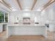Expansive kitchen featuring a large island with white countertops and luxury stainless steel appliances at 3212 Willow Oak Rd, Charlotte, NC 28209