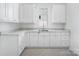 Kitchen with white cabinets and quartz countertops at 3212 Willow Oak Rd, Charlotte, NC 28209