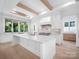 Spacious kitchen with a large center island, white cabinetry, and high-end appliances at 3212 Willow Oak Rd, Charlotte, NC 28209