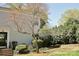 Traditional home with a well-manicured front yard featuring a decorative tree and lush green bushes at 3238 Pinehurst Pl # B, Charlotte, NC 28209
