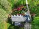 Beautiful aerial view of a landscaped property featuring a home with a screened porch at 3412 Country Club Dr, Gastonia, NC 28056