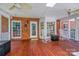A cozy back porch with rocking chairs and brick siding at 3412 Country Club Dr, Gastonia, NC 28056
