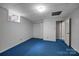 Finished basement bedroom with carpeting, closet, and a window for ample natural light at 3412 Country Club Dr, Gastonia, NC 28056