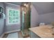 Updated bathroom featuring glass shower, tile surround, and modern fixtures at 3412 Country Club Dr, Gastonia, NC 28056