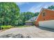 Charming home featuring a brick garage and screened porch, nestled among mature trees at 3412 Country Club Dr, Gastonia, NC 28056