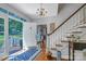 Inviting home foyer with hardwood floors, a view to the outside porch and staircase at 3412 Country Club Dr, Gastonia, NC 28056