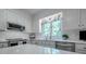 Bright kitchen featuring stainless steel appliances, white cabinets, quartz countertops, and a window at 3412 Country Club Dr, Gastonia, NC 28056