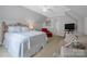 Comfortable main bedroom with ceiling fan, sitting area, and soothing natural light at 3412 Country Club Dr, Gastonia, NC 28056