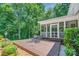 Inviting screened porch with a table and chairs, perfect for outdoor dining and relaxation at 3412 Country Club Dr, Gastonia, NC 28056