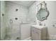 Bathroom featuring a glass shower, herringbone tile floor, gray vanity and modern fixtures at 3726 Providence Rd, Charlotte, NC 28211