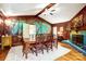 Formal dining room showcases a dark wood table, chairs, and a painted accent wall, exudes elegance at 3726 Providence Rd, Charlotte, NC 28211