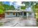 Charming home with a well-manicured front yard, a screened-in porch, and a spacious driveway at 3726 Providence Rd, Charlotte, NC 28211