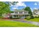 Charming two-story home featuring a welcoming front porch and beautifully landscaped front yard at 3726 Providence Rd, Charlotte, NC 28211