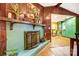 Charming fireplace with blue tiles, framed by rich wood paneling and decor, adds warmth at 3726 Providence Rd, Charlotte, NC 28211