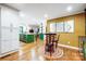 Open layout with kitchen island, breakfast nook, and seamless transition to dining area at 3726 Providence Rd, Charlotte, NC 28211