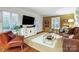 Cozy living room with hardwood floors, plantation shutters, and stylish decor creating a relaxing ambiance at 3726 Providence Rd, Charlotte, NC 28211