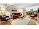 Bright living room featuring hardwood floors, a comfortable brown sofa, and modern decor at 3726 Providence Rd, Charlotte, NC 28211