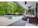 Outdoor patio and pool area with comfortable seating and dining space, perfect for relaxing and entertaining at 3726 Providence Rd, Charlotte, NC 28211