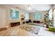 Bright sunroom with large windows, tile flooring, and plenty of space for relaxation and activities at 3726 Providence Rd, Charlotte, NC 28211