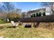 Relaxing backyard featuring an outdoor fire pit and chair setting perfect for entertaining at 3908 Parkers Ferry Rd, Fort Mill, SC 29715