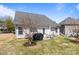 This backyard features a grill, patio seating, and tree at 3908 Parkers Ferry Rd, Fort Mill, SC 29715