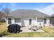 This backyard features a grill, patio seating, and tree at 3908 Parkers Ferry Rd, Fort Mill, SC 29715