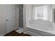 Bright bathroom featuring a tub and separate walk-in shower, offering convenience and style at 3908 Parkers Ferry Rd, Fort Mill, SC 29715