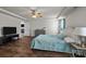 Spacious bedroom featuring tray ceilings, wood flooring, and a view to the entry to another room at 3908 Parkers Ferry Rd, Fort Mill, SC 29715