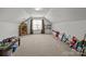 Bonus room with a window, tan carpet, light and dark brown accents, and a vaulted ceiling at 3908 Parkers Ferry Rd, Fort Mill, SC 29715