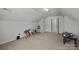 Bonus room with a window, tan carpet, vaulted ceiling, and two doors at 3908 Parkers Ferry Rd, Fort Mill, SC 29715