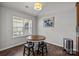Bright breakfast nook features a round wood table with seating for four and bright natural light at 3908 Parkers Ferry Rd, Fort Mill, SC 29715